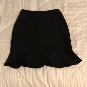 black pencil trumpet skirt
